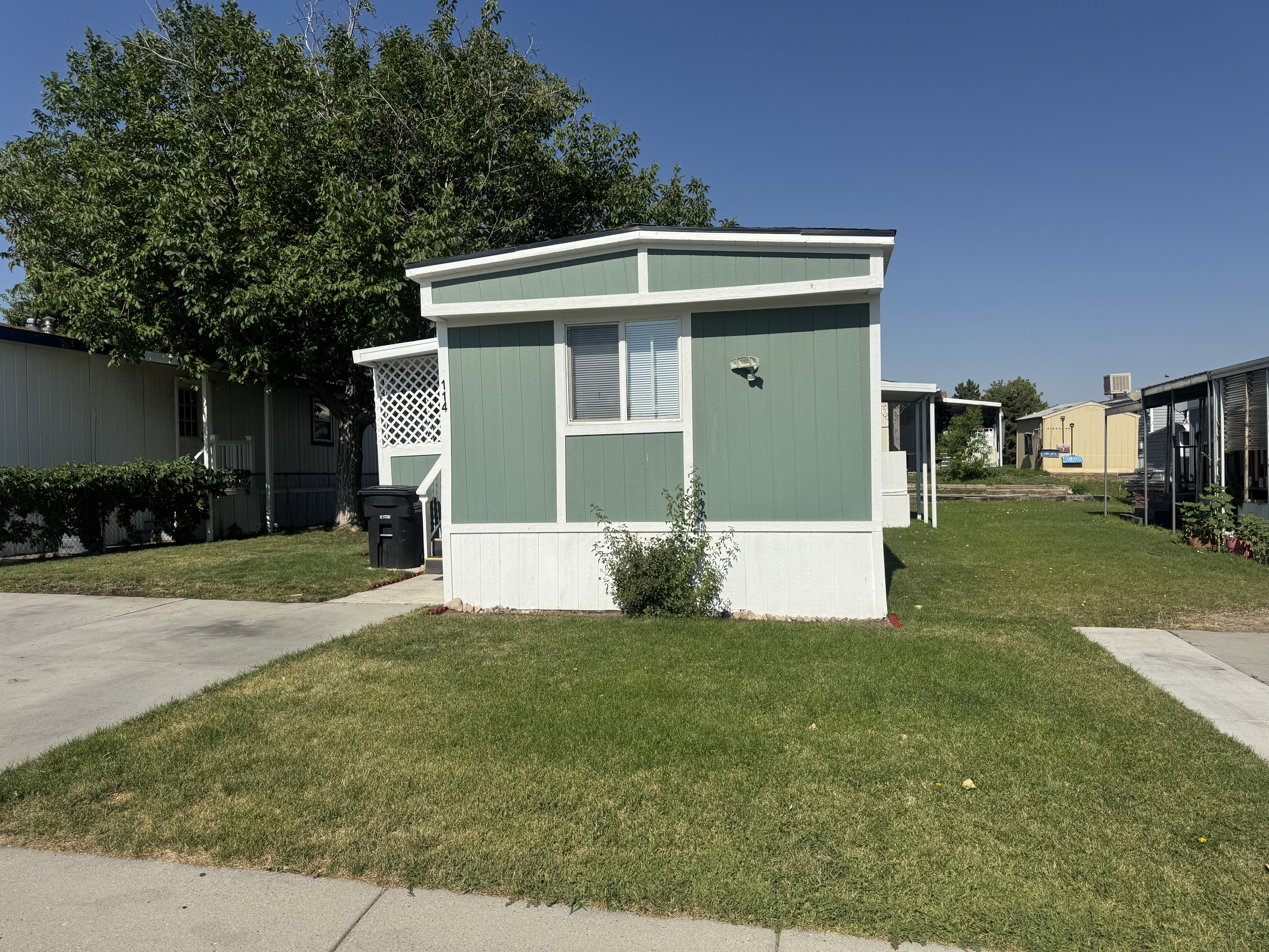 View of side of home featuring a lawn