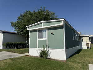 View of home's exterior featuring a yard