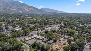 Aerial perspective of suburban area featuring a mountain backdrop