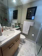 Bathroom with a stall shower and vanity