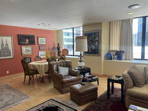 Living area with light wood finished floors and baseboards