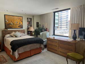 Bedroom with light carpet