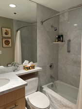 Bathroom featuring shower / tub combo and vanity