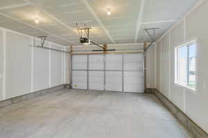 Garage featuring a garage door opener
