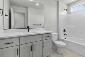 Full bath with vanity, shower / bathtub combination, tile patterned flooring, and recessed lighting