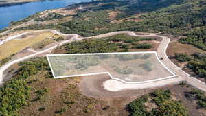 View of property location with property parcel outlined and a large body of water