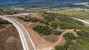 Aerial view of sparsely populated area with a mountainous background