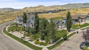 View of property location with mountains and nearby suburban area