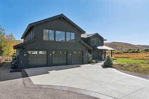 View of front of house featuring driveway and an attached garage