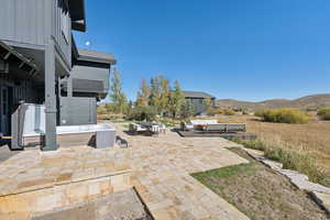 View of patio with an outdoor hangout area, outdoor dining area, and a mountain view