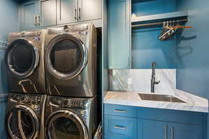 Washroom with cabinet space and independent washer and dryer