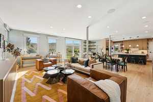 Living area featuring light wood-style flooring and recessed lighting