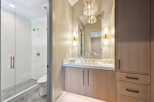 Full bathroom with vanity, a shower stall, and recessed lighting