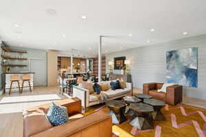 Living room with wood finished floors and recessed lighting