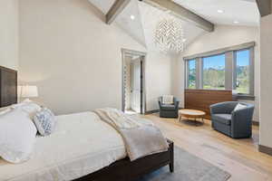 Bedroom featuring hardwood / wood-style floors, recessed lighting, and a chandelier
