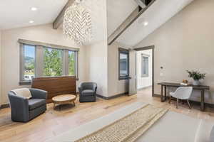 Sitting room with light wood-style floors, recessed lighting, and a chandelier