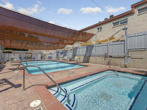 Community pool with a patio area