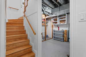 Unfinished basement featuring stairs