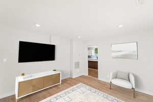 Full-size living room with brand new laminate flooring and large bay window. Let’s in the natural light and beautiful outdoor views