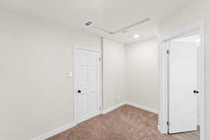 Fully carpeted bedroom/office includes private access to full bathroom.