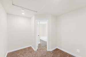 Fully carpeted bedroom/office includes private access to full bathroom.