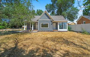 The outside features newly-poured sidewalks, 2 covered patios, outbuildings and plenty of parking space. The yard has space to play with large mature trees providing lots of shade