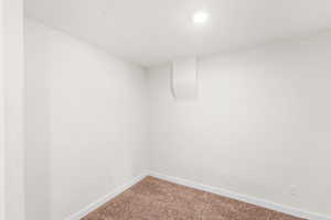 Fully carpeted bedroom/office includes private access to full bathroom.