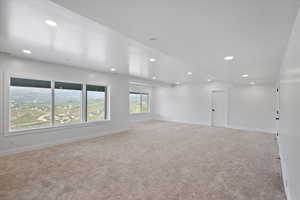 Large bright spacious family room with plenty of room for a pool or ping pong table and a nice sized sectional