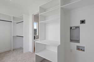 Large primary walk-in closet with laundry hook-ups
