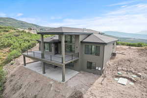 View of the back covered deck and patio