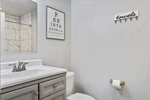 Bathroom with toilet and vanity