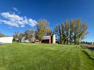 View of green lawn with an outdoor structure