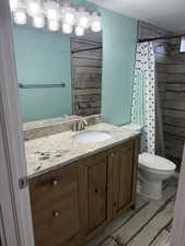 Full bathroom with vanity and tiled shower