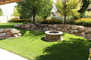 View of yard with a fire pit