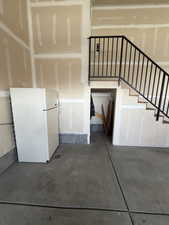 Stairs featuring concrete floors