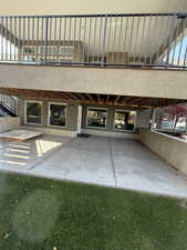 Property entrance featuring a patio and a lawn
