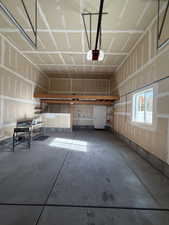 Garage featuring a garage door opener