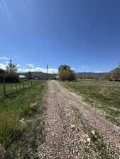 View of street featuring a view of rural / pastoral area and a mountain view