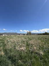 View of undeveloped land featuring rural landscape and a mountainous background