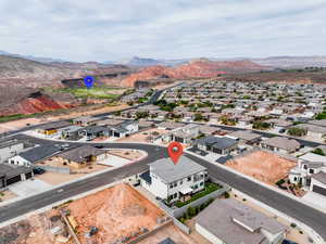 Aerial view of residential area featuring mountains