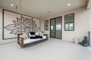 Bedroom featuring access to outside and recessed lighting