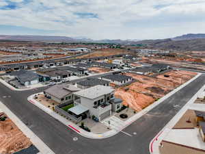 Aerial perspective of suburban area featuring a mountain backdrop