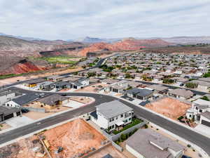 Aerial perspective of suburban area featuring a mountain backdrop