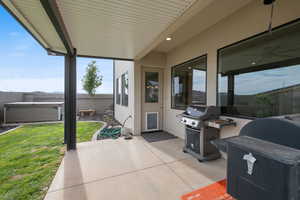Fenced backyard with a patio area and area for grilling