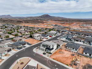 Aerial view of residential area featuring a mountainous background