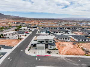 Aerial view of residential area featuring a mountainous background