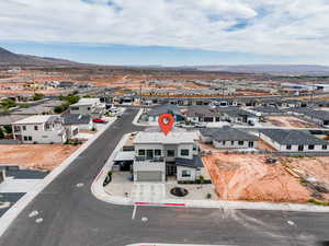 Aerial perspective of suburban area with a mountain backdrop