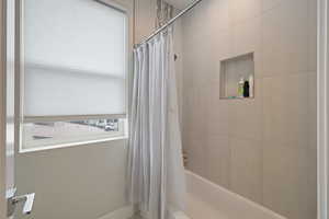 Full bathroom featuring shower / bath combo