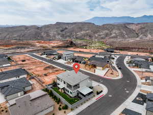 Aerial view of residential area featuring a mountainous background