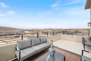 Patio / terrace featuring an outdoor living space, a residential view, and a mountain view